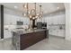 Spacious kitchen island with granite countertops and a dark wood base at 22847 E Sonoqui Blvd, Queen Creek, AZ 85142