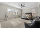 Spacious main bedroom with a king-size bed and ceiling fan at 22847 E Sonoqui Blvd, Queen Creek, AZ 85142