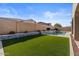 Relaxing pool with waterfall feature and artificial turf at 22847 E Sonoqui Blvd, Queen Creek, AZ 85142