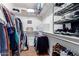 Well-organized walk-in closet with shelving and hanging rods at 24502 S Starcrest Dr, Sun Lakes, AZ 85248