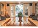 Elegant clubhouse lobby with seating and glass-top table at 24502 S Starcrest Dr, Sun Lakes, AZ 85248