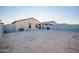 Large backyard with block wall and empty space at 24550 W Pima St, Buckeye, AZ 85326