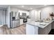 Modern kitchen featuring stainless steel appliances and granite countertops at 24550 W Pima St, Buckeye, AZ 85326