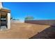 Large backyard with block wall and desert landscaping at 25233 N 131St Dr, Peoria, AZ 85383