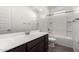 Bathroom with single sink vanity, tub, and tile flooring at 25233 N 131St Dr, Peoria, AZ 85383