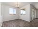 Bright dining room with tile floors and sliding glass doors at 25233 N 131St Dr, Peoria, AZ 85383