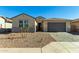 One-story home with a two-car garage and desert landscaping at 25233 N 131St Dr, Peoria, AZ 85383