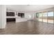 Modern kitchen featuring dark cabinetry, island, and tile floors at 25233 N 131St Dr, Peoria, AZ 85383