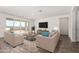 Bright living room with tile floors and sliding glass doors at 25233 N 131St Dr, Peoria, AZ 85383