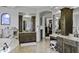 Double vanity bathroom with a soaking tub and walk-in closet at 25763 N 116Th St, Scottsdale, AZ 85255