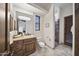 Elegant bathroom with wood vanity, shower, and tile flooring at 25763 N 116Th St, Scottsdale, AZ 85255