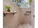 Outdoor shower with stone shelves and privacy walls at 25763 N 116Th St, Scottsdale, AZ 85255