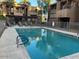 Relaxing community pool with lounge chairs and patio at 2625 E Indian School Rd # 226, Phoenix, AZ 85016