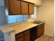 Kitchen features light countertops and wood cabinets at 2625 E Indian School Rd # 226, Phoenix, AZ 85016