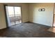 Living room with sliding door to outdoor patio at 2625 E Indian School Rd # 226, Phoenix, AZ 85016