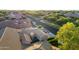 Aerial view of a house and neighborhood with lush landscaping and tree-lined streets at 3111 E Red Oak Ct, Gilbert, AZ 85297