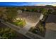 Aerial view of a single story house with a two-car garage, beautifully landscaped front yard at 3111 E Red Oak Ct, Gilbert, AZ 85297