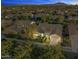 Night view of a house and neighborhood, showing surrounding homes and landscape at 3111 E Red Oak Ct, Gilbert, AZ 85297