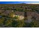 Aerial view of a single-story house with a two-car garage and landscaped yard at 3111 E Red Oak Ct, Gilbert, AZ 85297