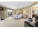 Main bedroom with a four-poster bed, ample natural light, and a sitting area at 3111 E Red Oak Ct, Gilbert, AZ 85297