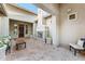 Brick courtyard with fireplace and seating area, near entryway at 3111 E Red Oak Ct, Gilbert, AZ 85297