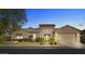 Elegant home exterior at dusk with landscaping and garage at 3111 E Red Oak Ct, Gilbert, AZ 85297