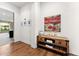 Bright hallway with hardwood floors and decorative console table at 3111 E Red Oak Ct, Gilbert, AZ 85297