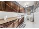 Bright laundry room with shaker cabinets and hexagon tile floor at 3111 E Red Oak Ct, Gilbert, AZ 85297