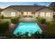 Inviting rectangular pool with brick coping and lush landscaping at 3111 E Red Oak Ct, Gilbert, AZ 85297