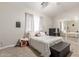 Bedroom with carpeted floors, mirrored closet, and large windows at 335 S Stardust Ln, Apache Junction, AZ 85120