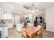 Bright kitchen with stainless steel appliances and adjacent dining area at 335 S Stardust Ln, Apache Junction, AZ 85120