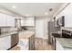 Kitchen with ample storage space, island, and stainless steel appliances at 335 S Stardust Ln, Apache Junction, AZ 85120