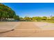 Full basketball court with well-maintained surface, basketball hoops, and greenery surrounding it at 3412 E Indigo Cir, Mesa, AZ 85213