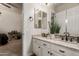 Bathroom with double vanity sinks, granite countertops, and updated fixtures at 3412 E Indigo Cir, Mesa, AZ 85213