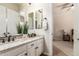 Well-lit bathroom with double vanity and granite countertop at 3412 E Indigo Cir, Mesa, AZ 85213