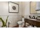 Modern powder room with dark vanity and patterned tile at 3412 E Indigo Cir, Mesa, AZ 85213