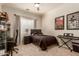 Bright bedroom with window, desk and keyboard at 3412 E Indigo Cir, Mesa, AZ 85213