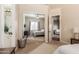 Bedroom view showcasing mirrored closet doors and neutral decor, for a light aesthetic at 3412 E Indigo Cir, Mesa, AZ 85213