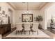 Bright dining room with seating for six and a large mirror at 3412 E Indigo Cir, Mesa, AZ 85213