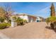 House with three-car garage and paver driveway at 3412 E Indigo Cir, Mesa, AZ 85213