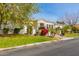 House exterior showcasing stone facade and lush landscaping at 3412 E Indigo Cir, Mesa, AZ 85213