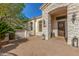 Elegant front entrance with stone details and a wooden door at 3412 E Indigo Cir, Mesa, AZ 85213