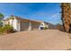 Three-car garage with paver driveway and gated entrance at 3412 E Indigo Cir, Mesa, AZ 85213