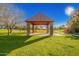 A charming gazebo in a well-maintained community park, perfect for outdoor gatherings and relaxation at 3412 E Indigo Cir, Mesa, AZ 85213