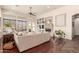 Living room boasts hardwood floors, a fireplace, and ample natural light at 3412 E Indigo Cir, Mesa, AZ 85213