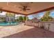 Outdoor kitchen with built-in grill, sink, and ample counter space at 3412 E Indigo Cir, Mesa, AZ 85213