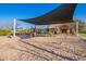 Community playground with shade structure over the play equipment and a picnic shelter at 3412 E Indigo Cir, Mesa, AZ 85213