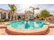 Resort-style pool with fountain and lush landscaping at 3412 E Indigo Cir, Mesa, AZ 85213