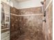 Large walk-in shower with tiled walls and built-in seat at 3412 E Indigo Cir, Mesa, AZ 85213