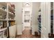 Large walk-in pantry offering extensive shelving for storage at 3412 E Indigo Cir, Mesa, AZ 85213